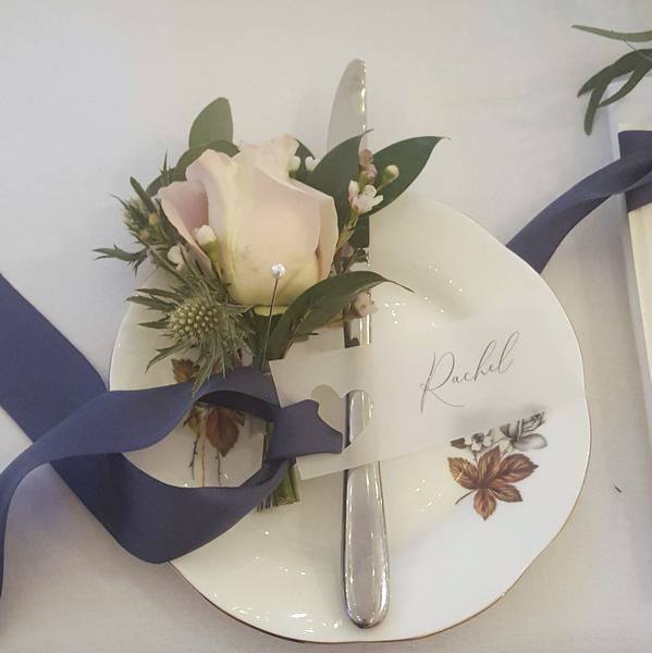 vellum place tag with calligraphy and navy silk ribbon