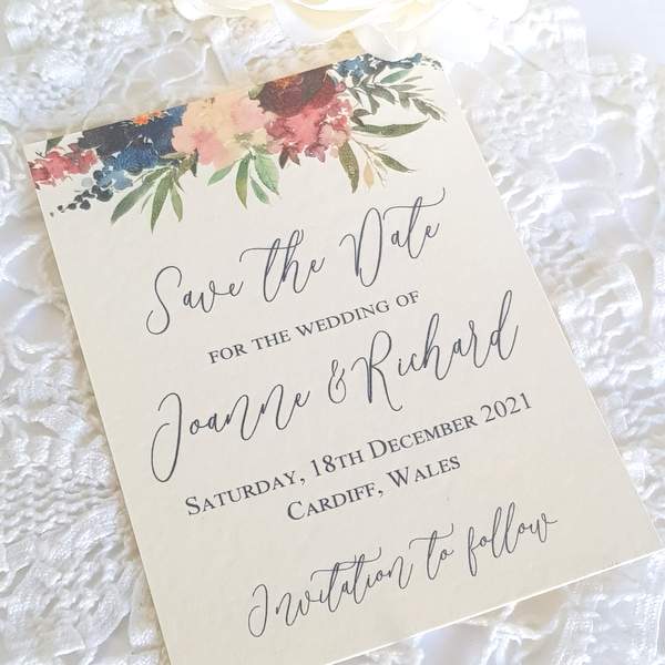 wedding save the date card with a burgundy and navy watercolour floral design