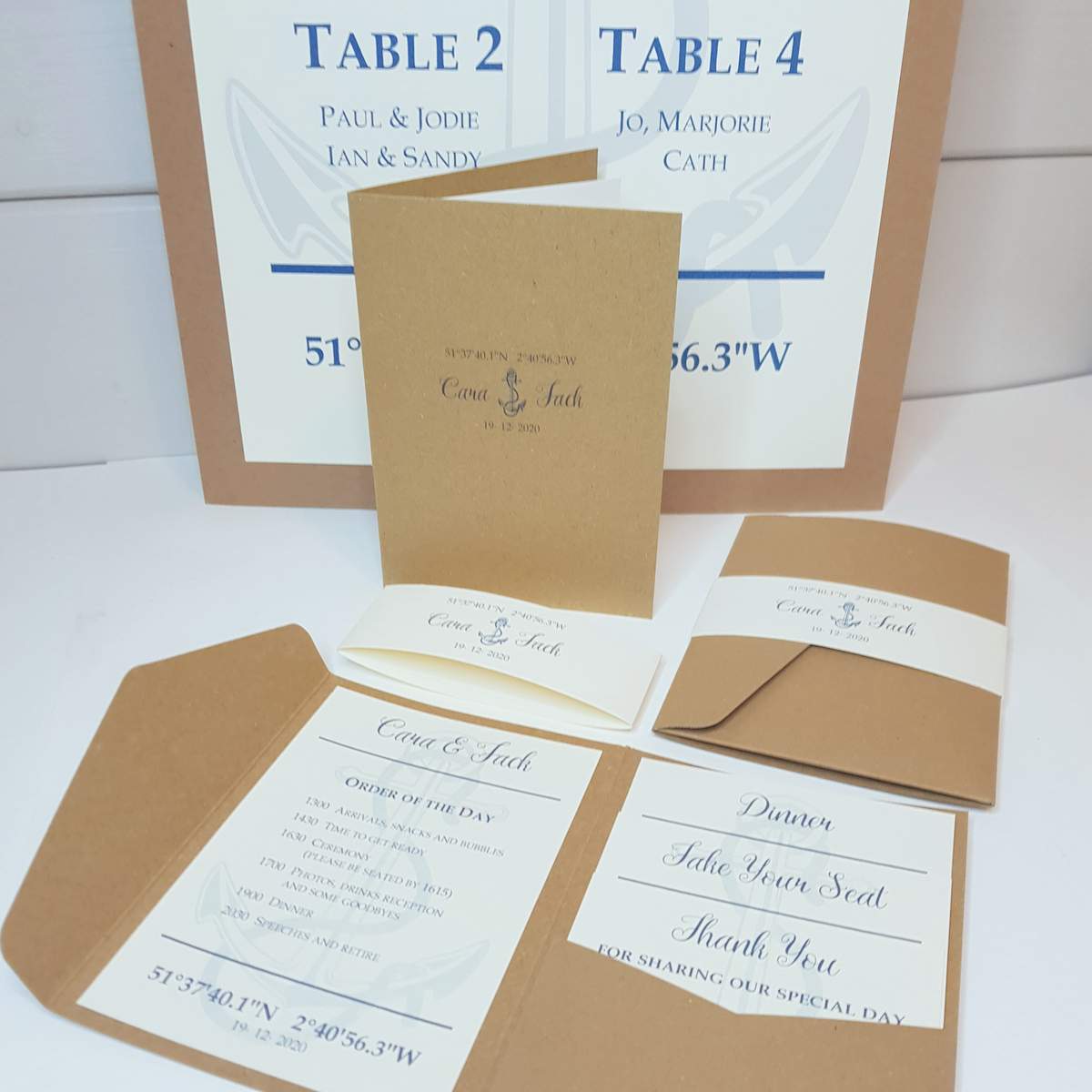 recycled kraft wedding stationery with a navy anchor design