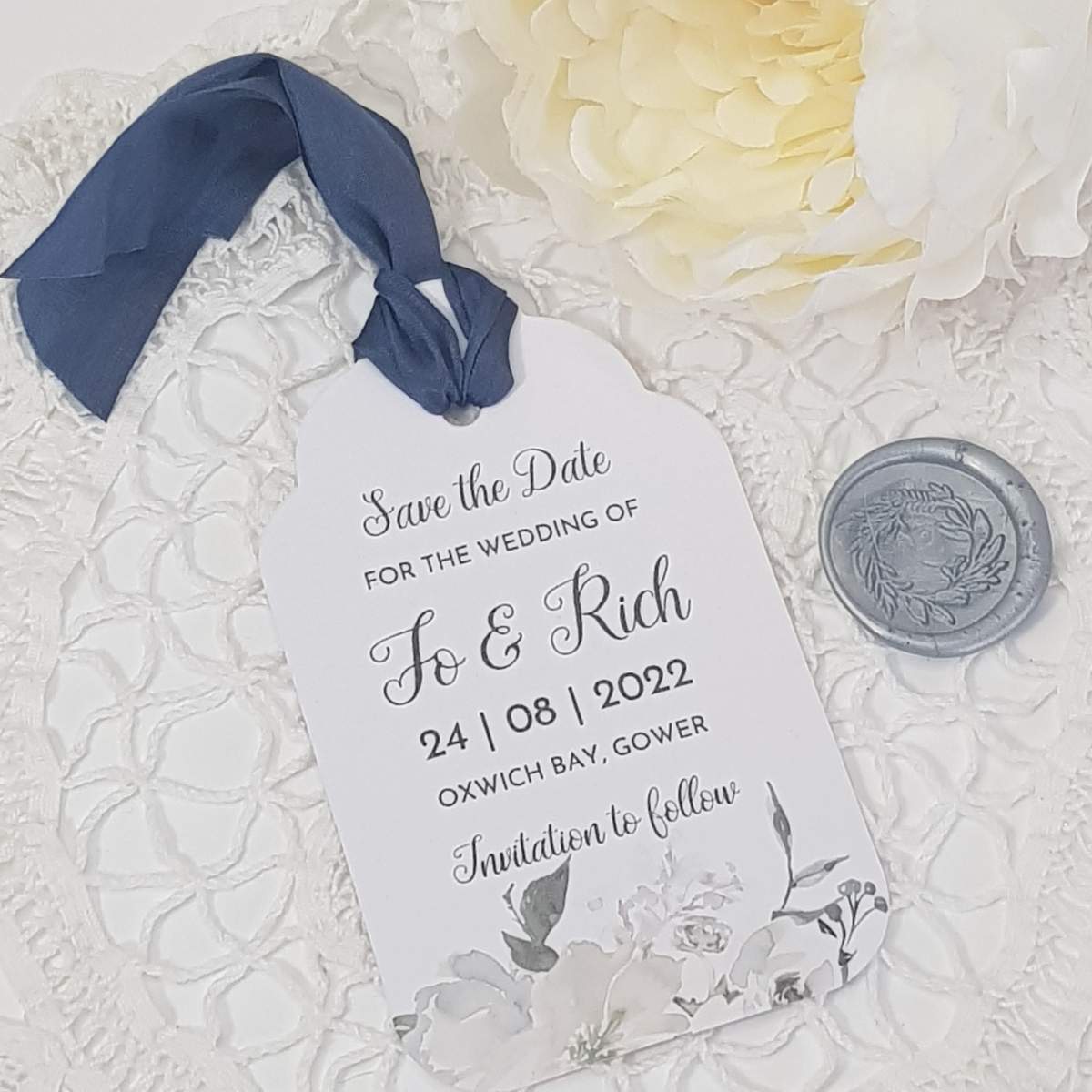 white floral save the date tag with silk ribbon