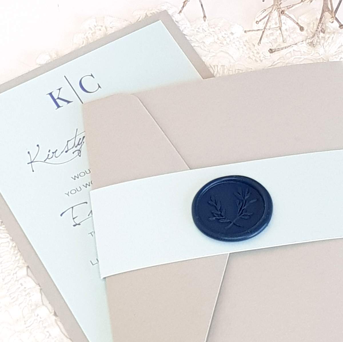 modern monogram invitations in pale grey and blue with a navy wax seal