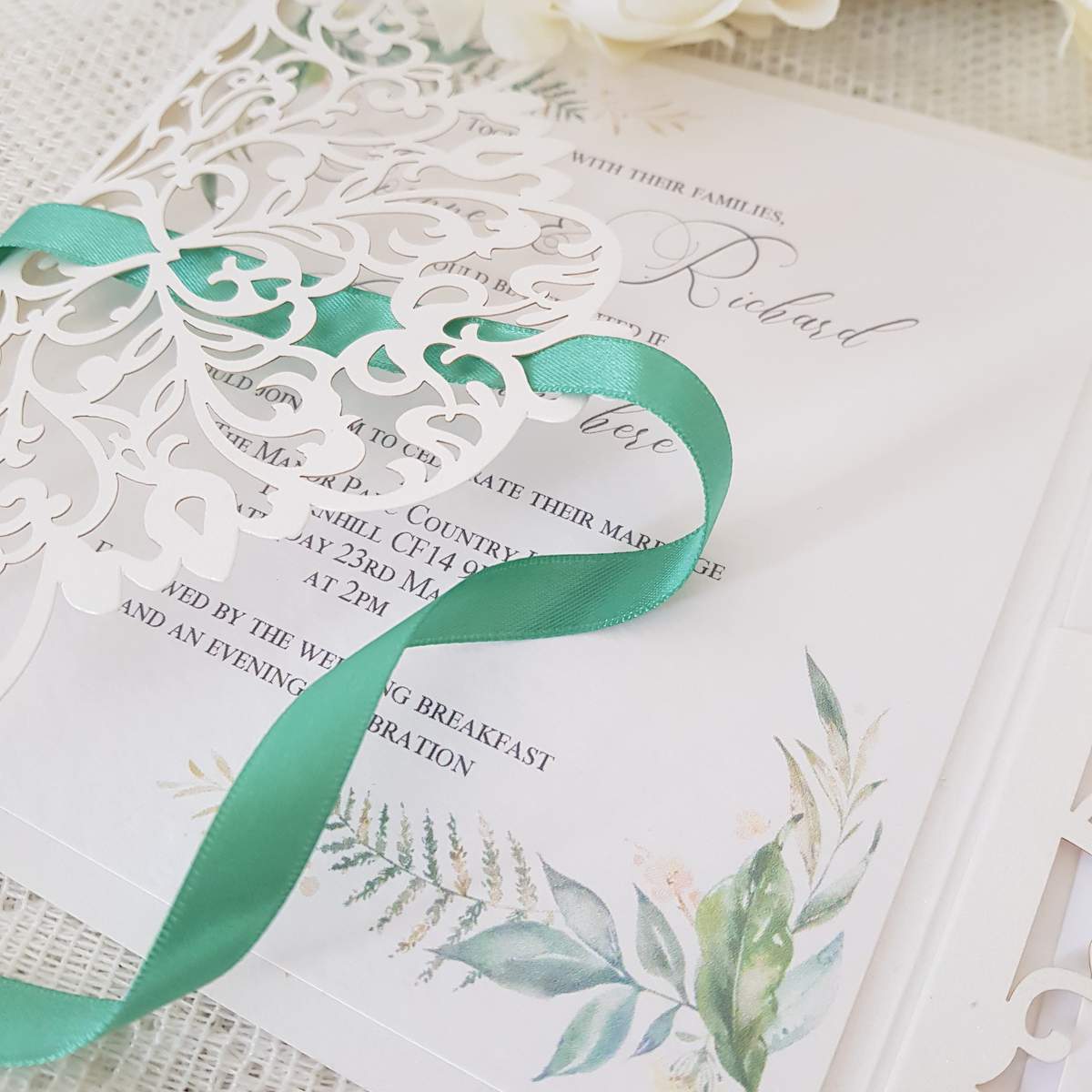 laser cut wedding invitation with woodland foliage design