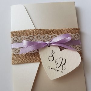 wedding invitation with hessian lace and lilac ribbon