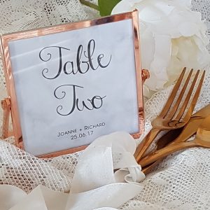 marble table number with copper frame