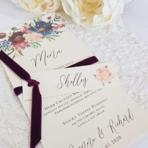 handmade wedding menu with burgundy ribbon