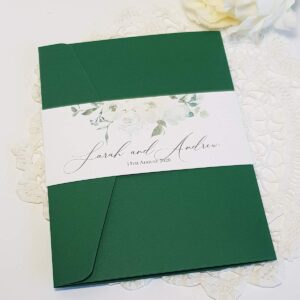 green and white pocket invitation with a bellyband