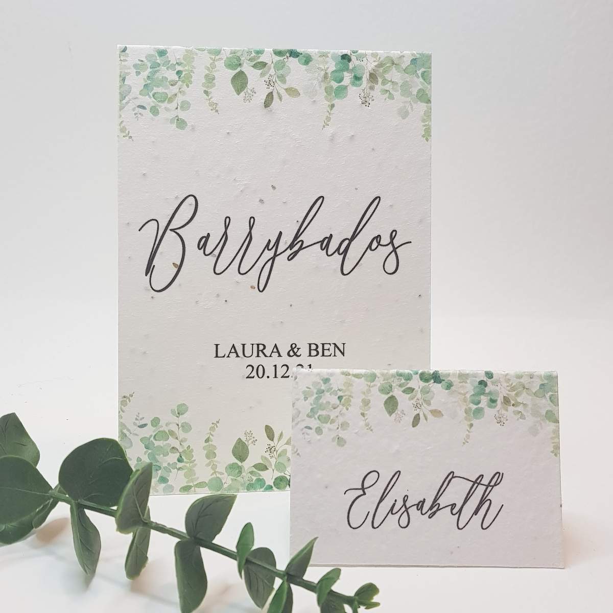 wedding table name and place card with a greenery design, printed onto plantable seed paper