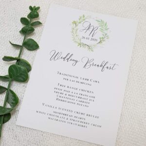 wedding breakfast menu with a greenery wreath design