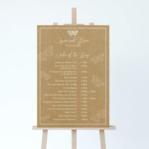 a rustic kraft wedding order of events with white print and butterfly motifs