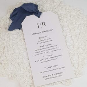 tag style personalised wedding menu with dark grey silk ribbon