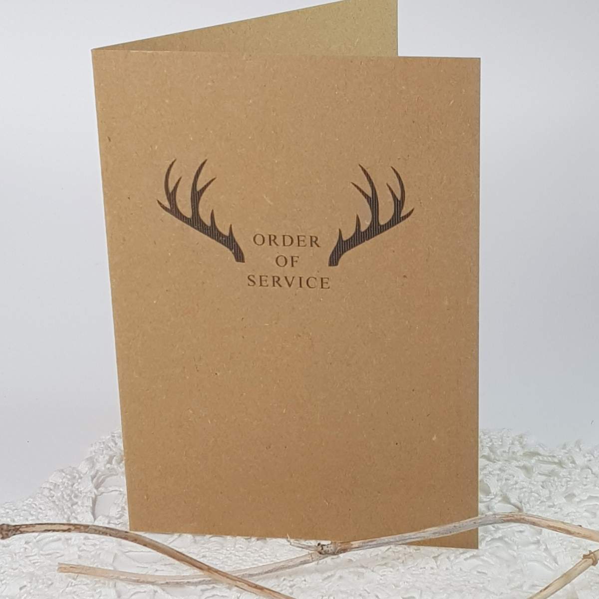wedding order of service with a stag design, printed on recycled card