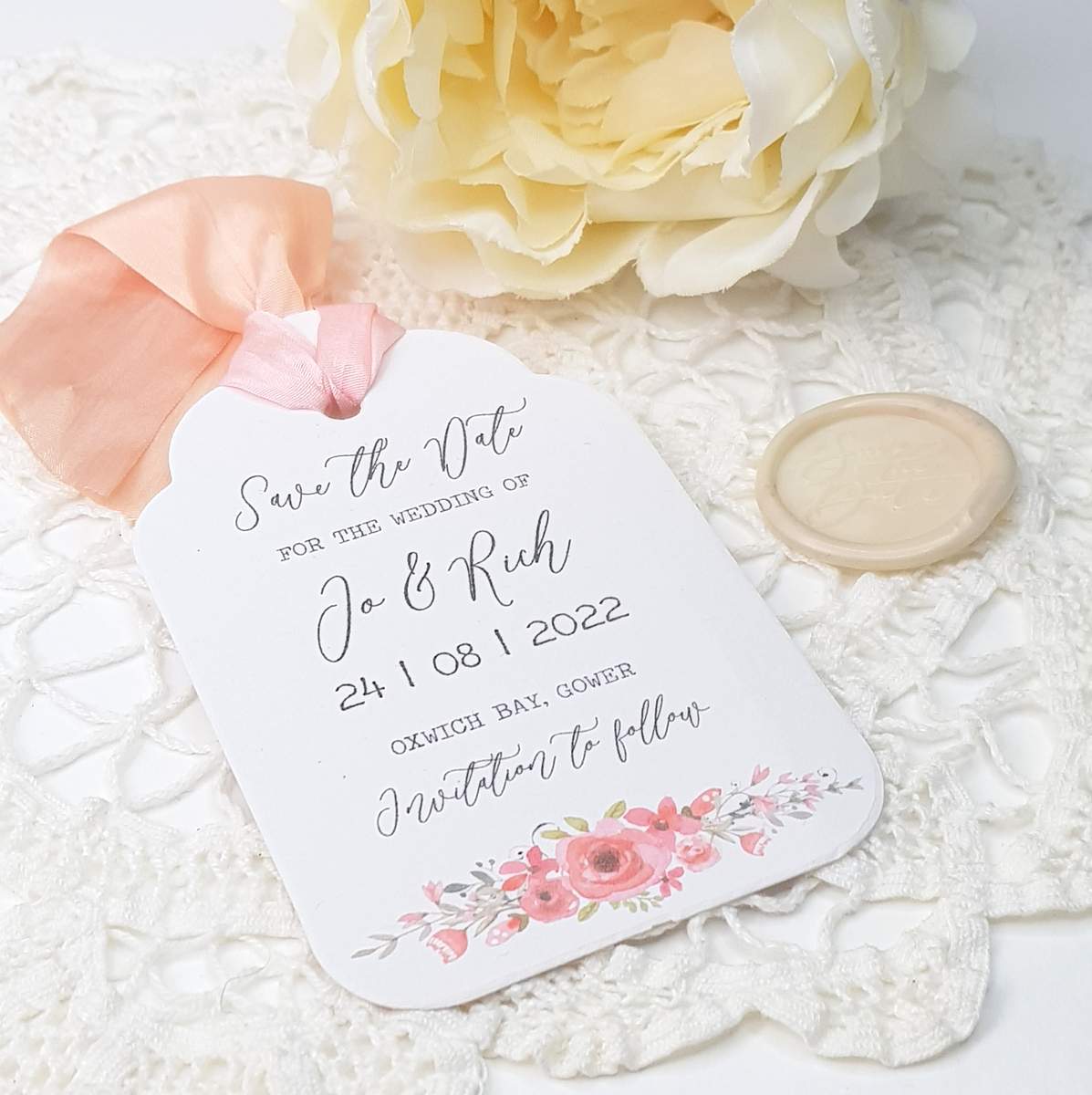 save the date luggage tag with pink flowers
