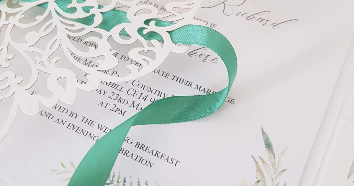 laser cut wedding invitation with woodland foliage design