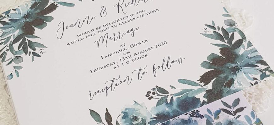 concertina style wedding invitation with a navy blue floral design
