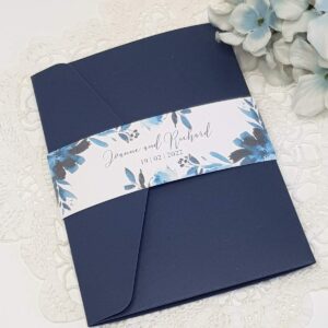 navy wedding invitation with a printed floral bellyband