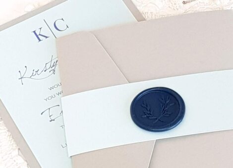 wedding invitation with bellyband and wax seal