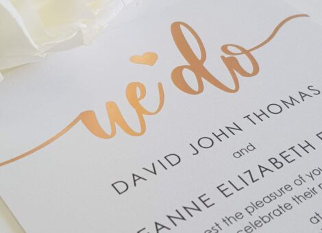 modern calligraphy style wedding invitation with rose gold foil