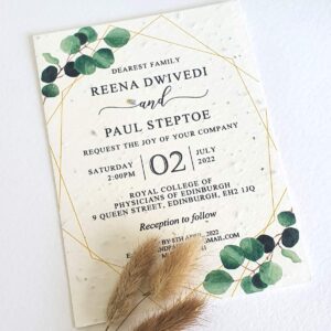 a wedding invitation with a eucalyptus leaf design, printed onto plantable seed paper