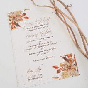 an evening reception wedding invites with an autumnal theme print in browns and oranges