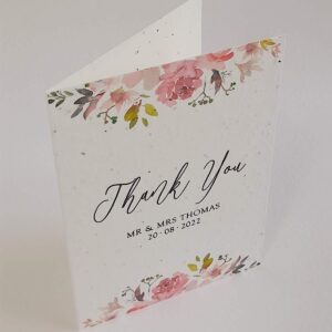 a wedding thank you card with pink floral design, printed onto plantable seed paper