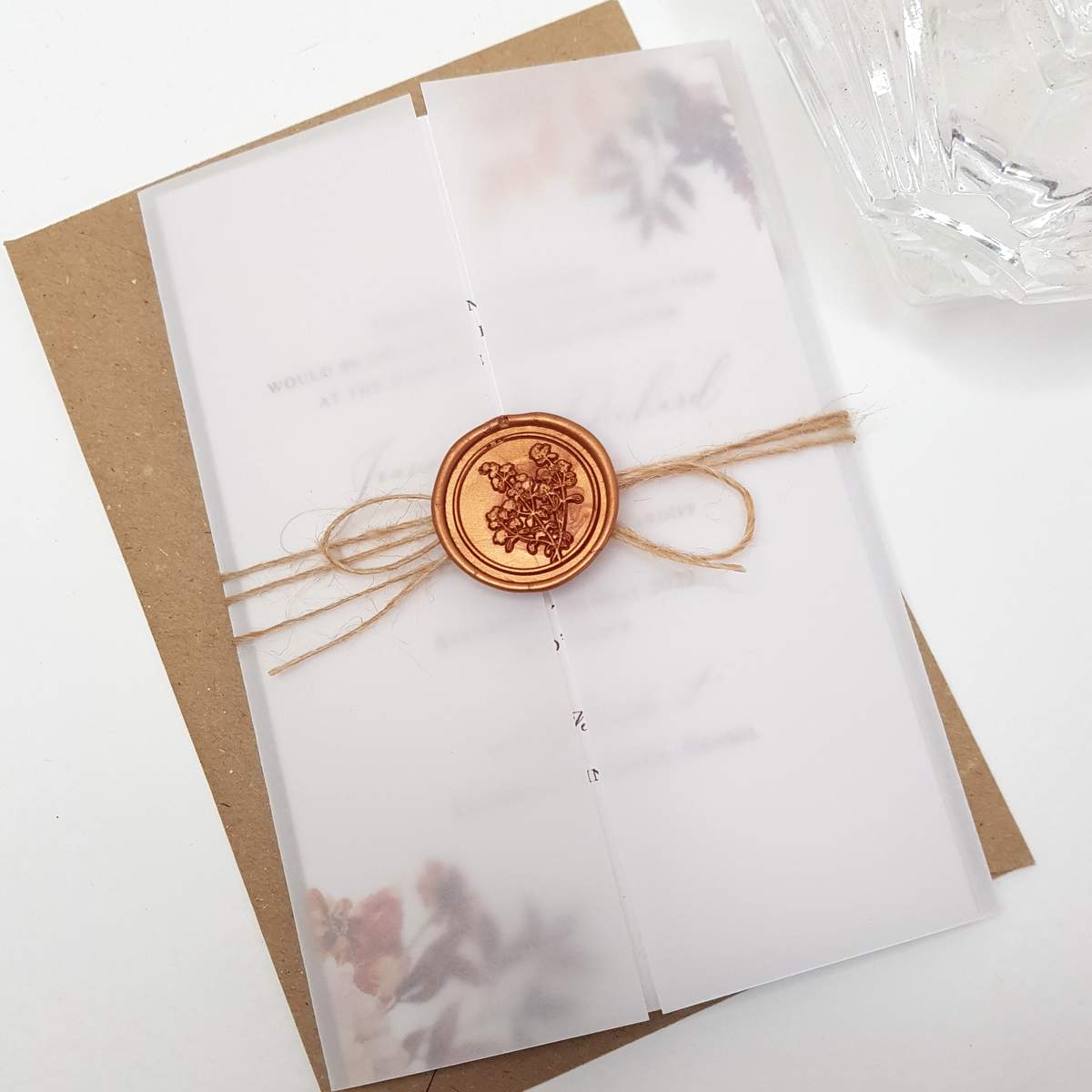 autumn design wedding invitation printed on recycled paper with a vellum jacket, jute twine and a copper wax seal