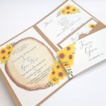 pocketfold wedding invitation with sunflowers and log slice