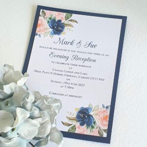 an evening wedding invitation with pretty blue and pink floral details