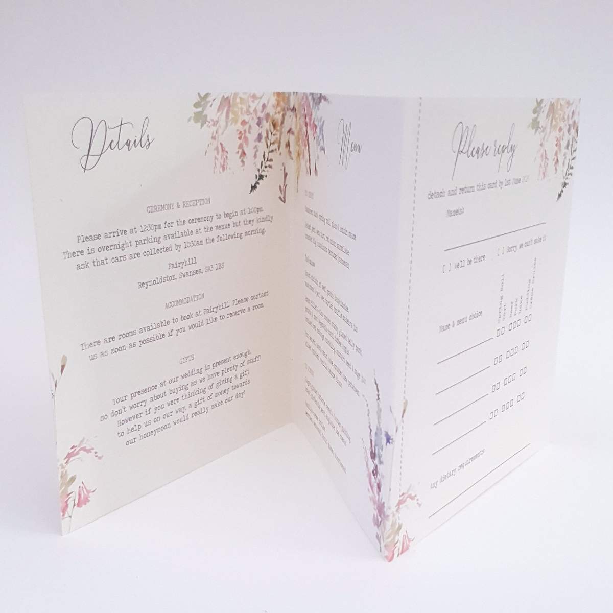 inside a concertina style wedding invitation with pastel floral design