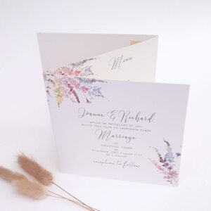 a double folding wedding invitation with meadow flowers design on the front and information panels