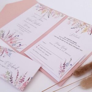 pink pocketfold wedding invitation with pretty wild flower design on the inserts