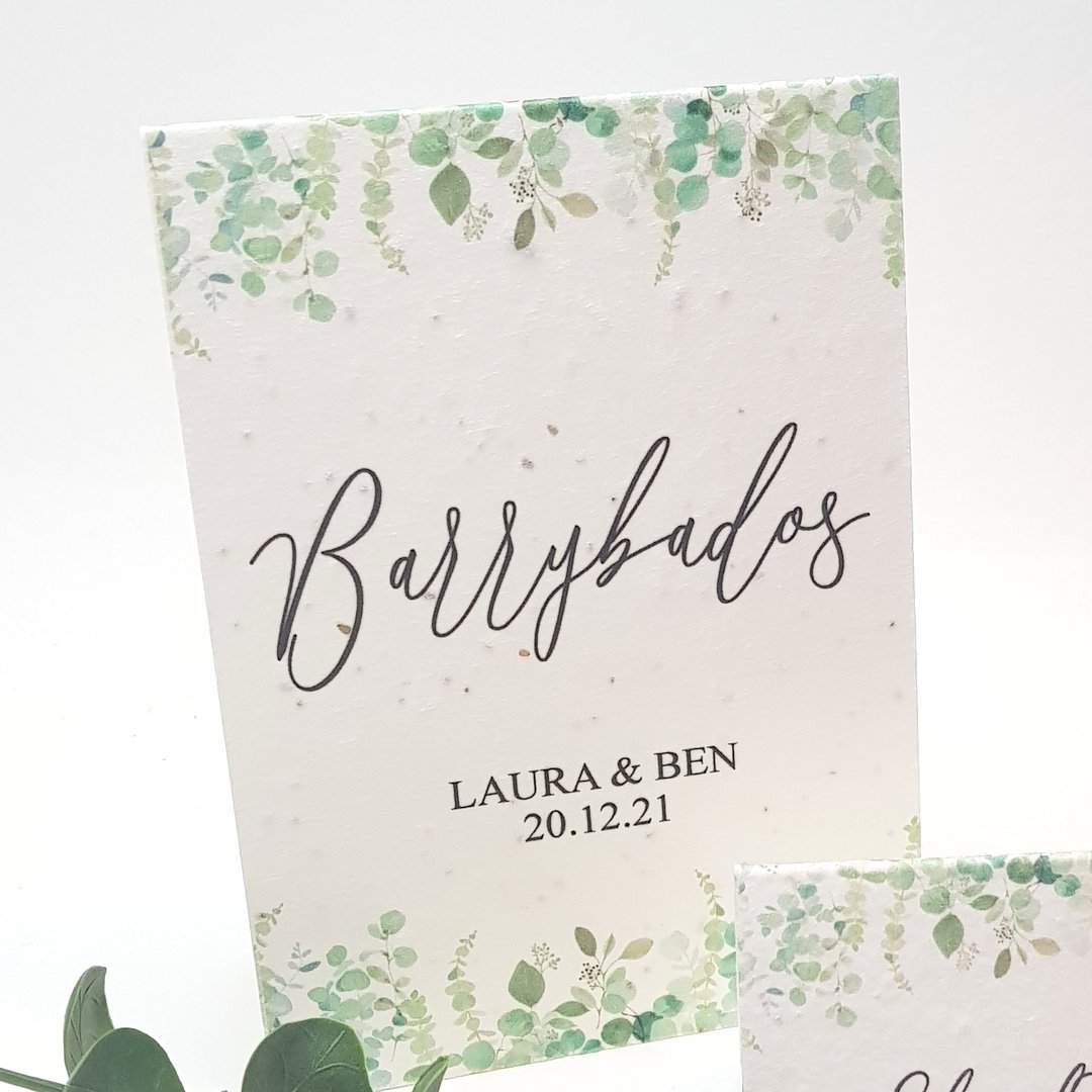 seeded paper wedding table name card with a greenery design