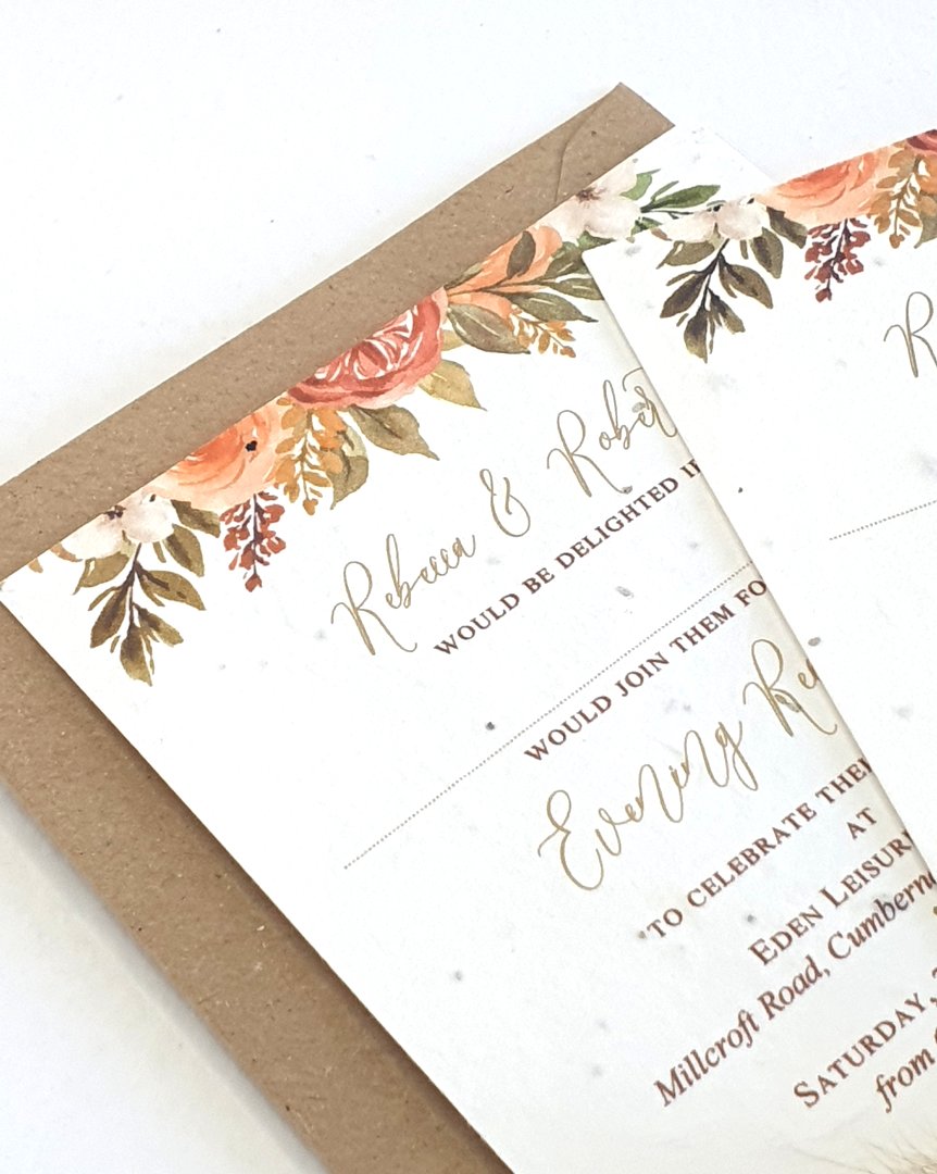 evening wedding invitations with an autumnal design, sitting on a recycled kraft brown envelope