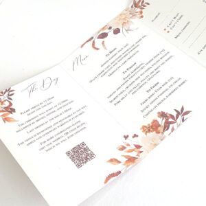 a wedding invitation with an autumnal design, it shows QR code to be scanned for further details