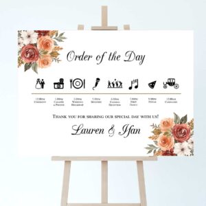 a wedding order of the day sign on an easel with an autumnal design