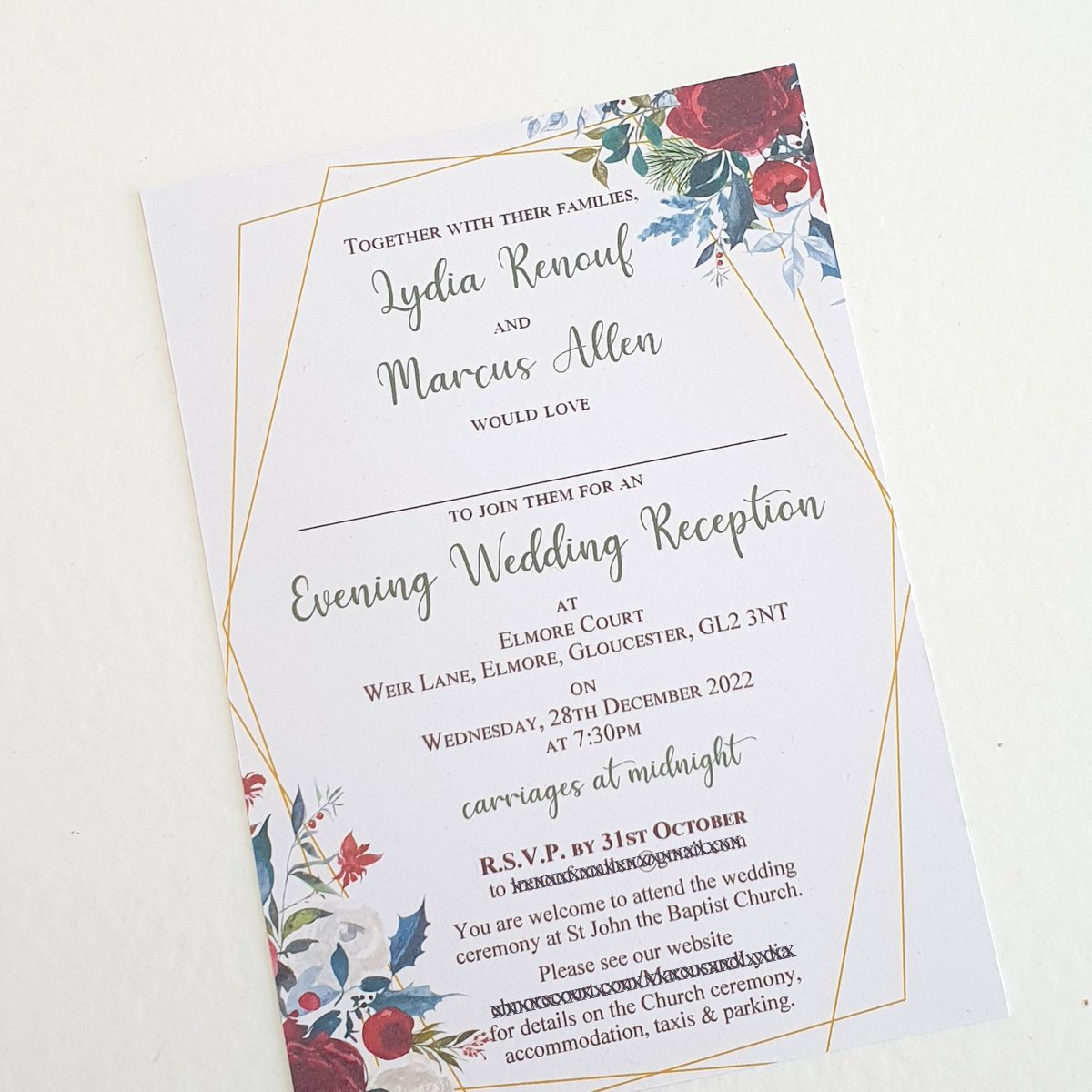 an evening invitation for a christmas wedding, with red flowers and green foliage in the corners