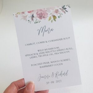 a wedding menu card with mauve floral print