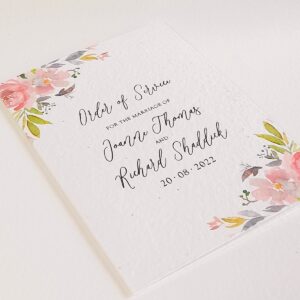 a wedding order of service card with mauve floral accents, printed onto plantable seed paper