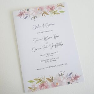 the front cover of a wedding order of service card with mauve floral printed design