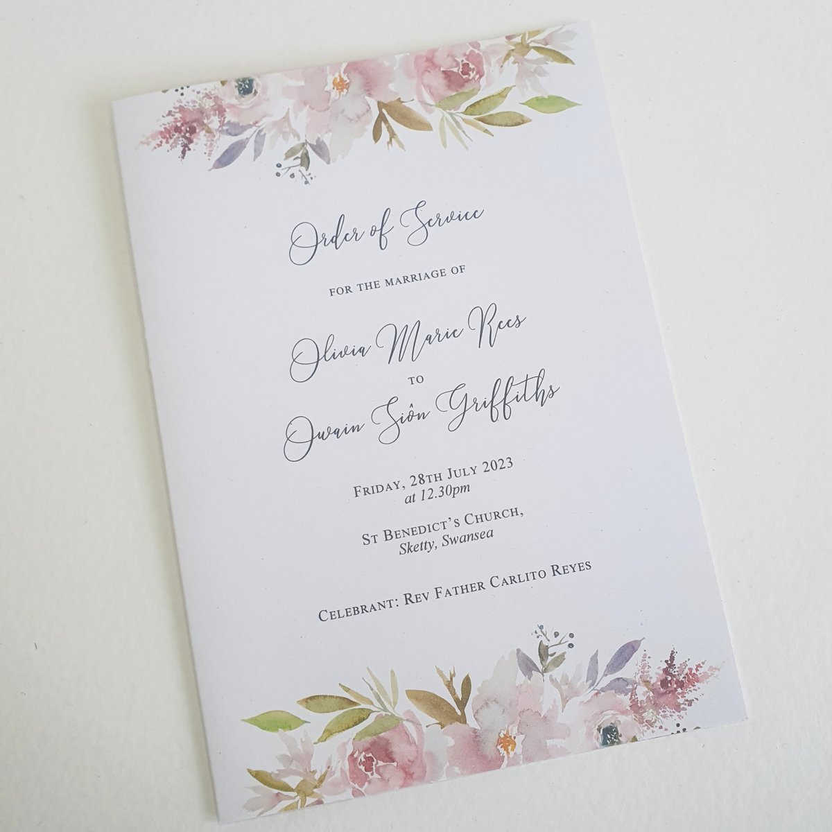 the front cover of a wedding order of service card with mauve floral printed design