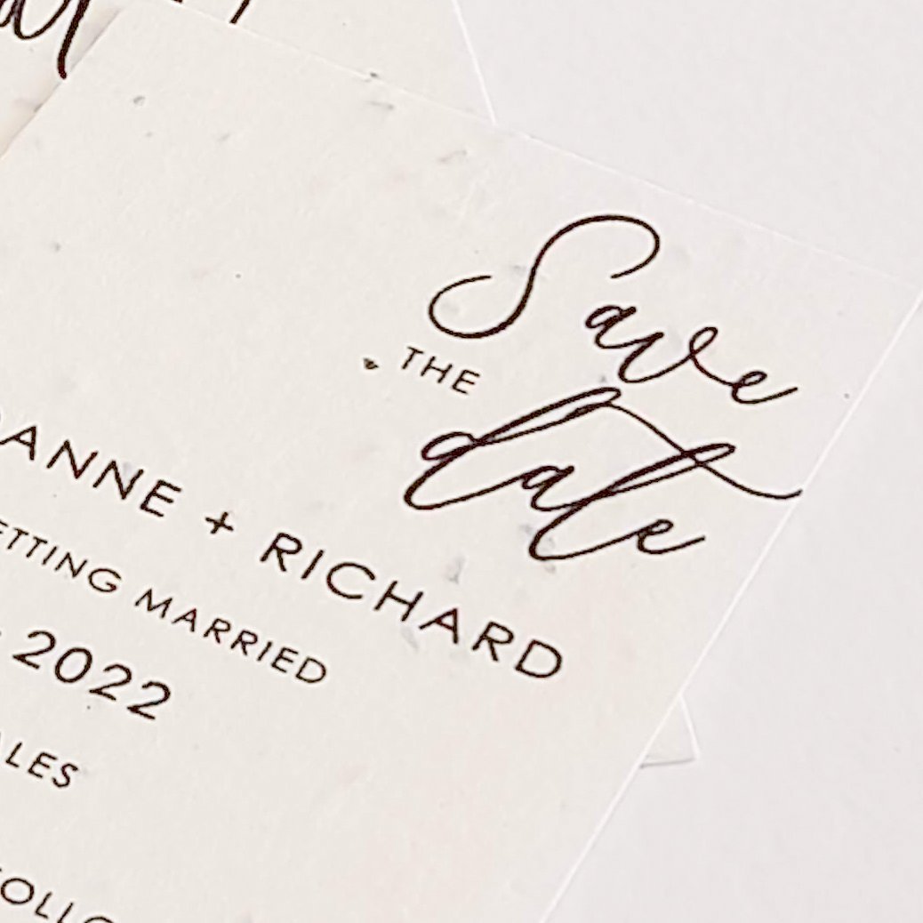 a modern calligraphy style seed paper save the date card for a wedding