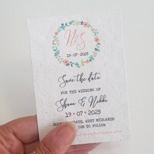 wedding save the date card with a floral hoop design